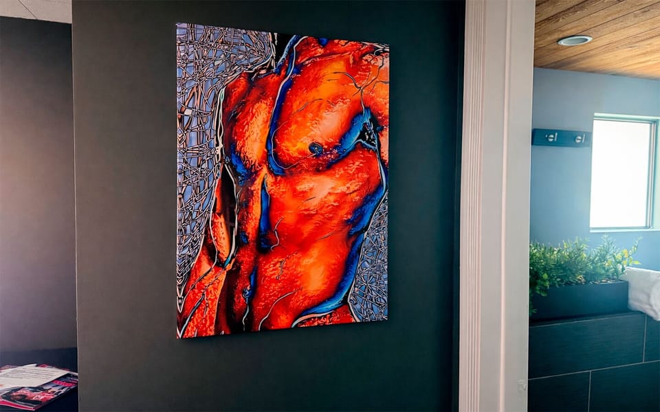 Modern statement artwork featured in The Red Room, enhancing the room’s distinctive design aesthetic.