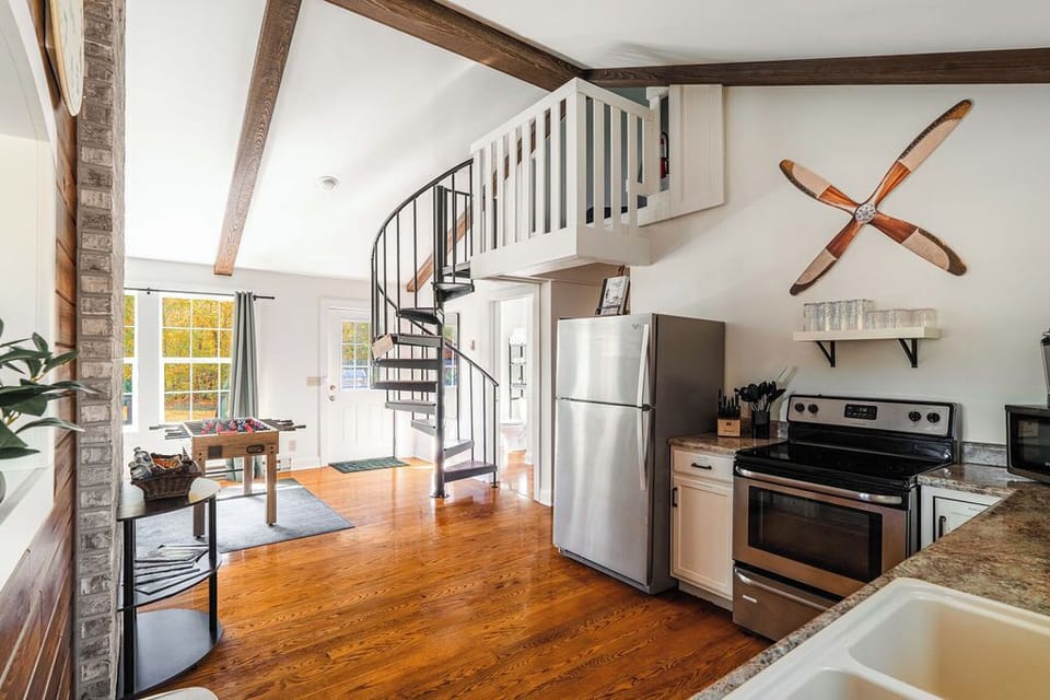 Whip up meals in the fully equipped kitchen and challenge your crew to foosball—then head up the spiral staircase to a stargazer’s loft hideout.