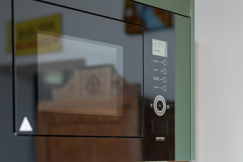 The apartment comes with practical equipment such as a microwave and everything needed for a comfortable stay.