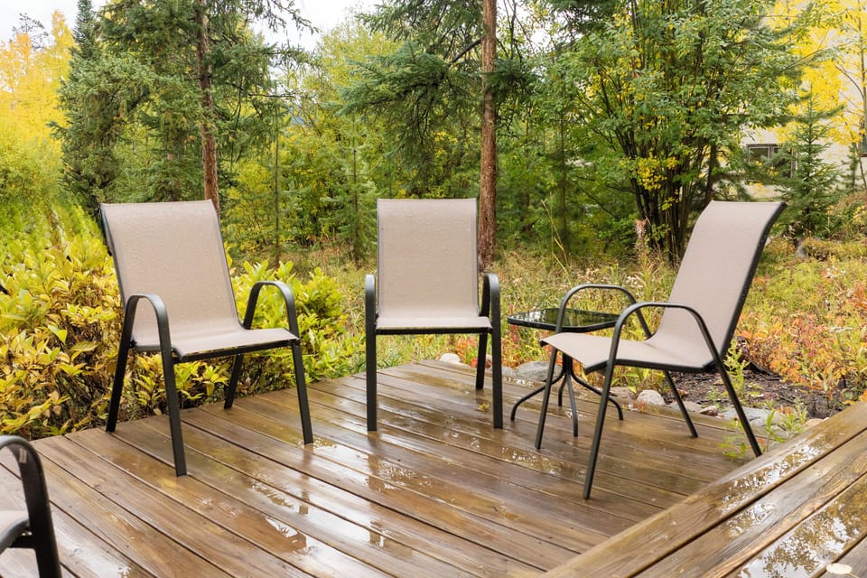 Your private deck offers peaceful seating among autumn colors, perfect for morning coffee or evening relaxation surrounded by nature.