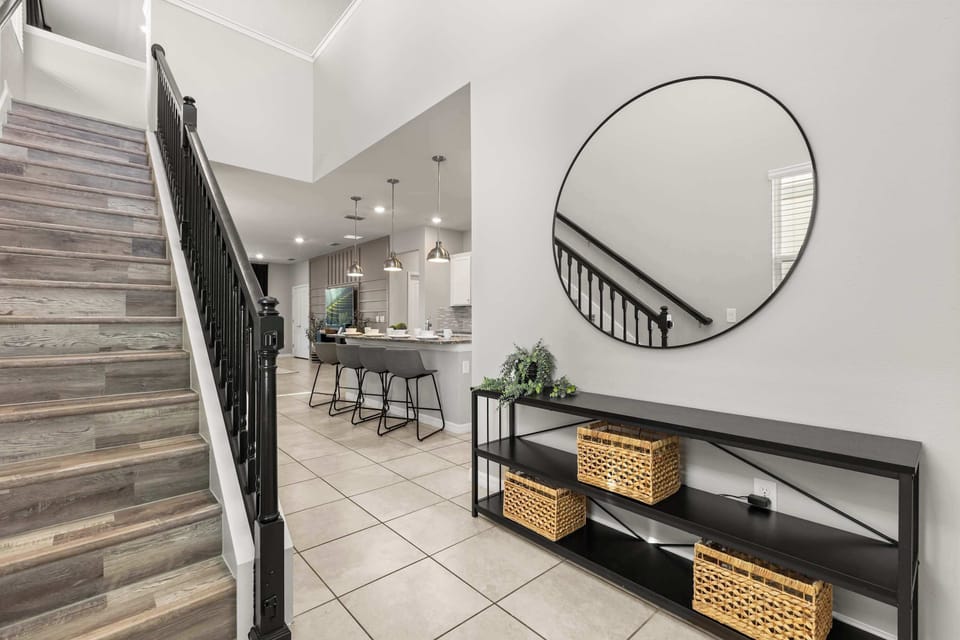 Interior hallway and stairs leading upstairs