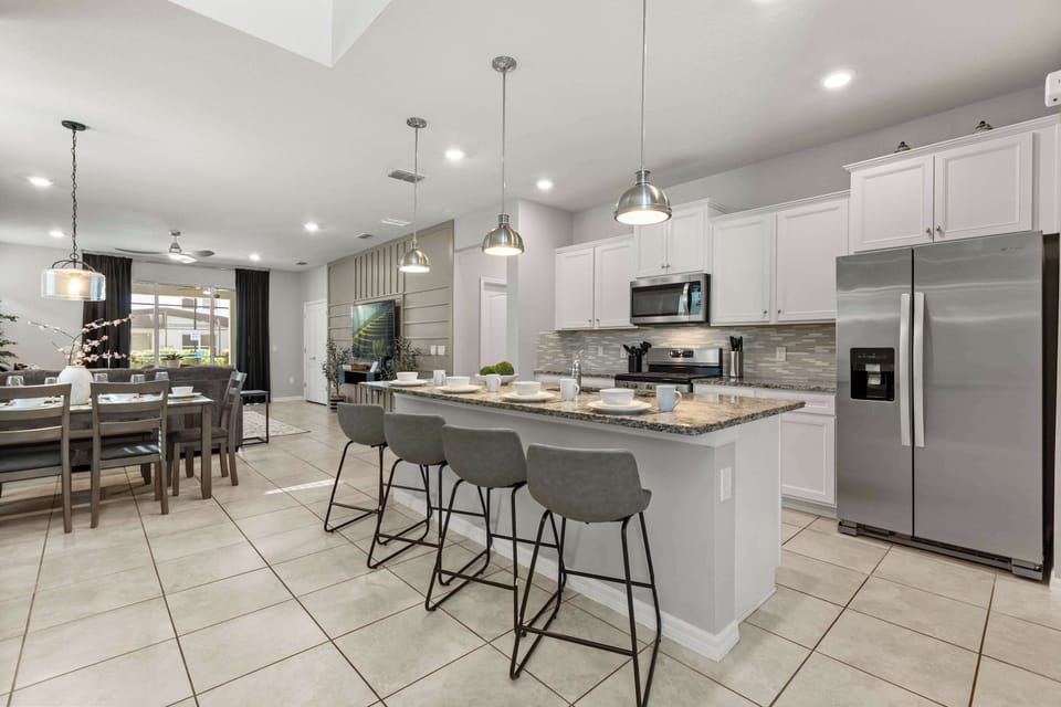 Kitchen - Fully stocked kitchen features modern appliances, generous counter space, and all the essentials for cooking at home.
