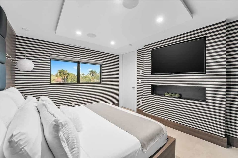 Elegant bedrooms with Alaskan King & King beds, hotel-quality linens, smart TVs, and plenty of storage.