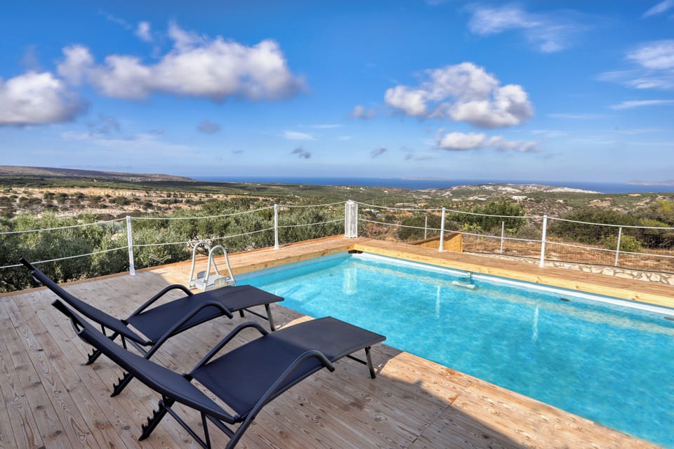 Outdoor space with spectacular views,  swimming pool, sun beds and sitting areas