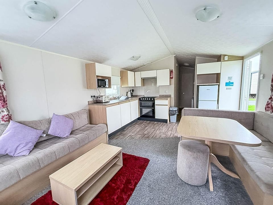 Cozy living and dining area with modern kitchen amenities