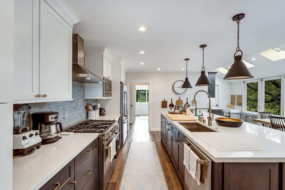Spacious kitchen with modern appliances and bright island seating