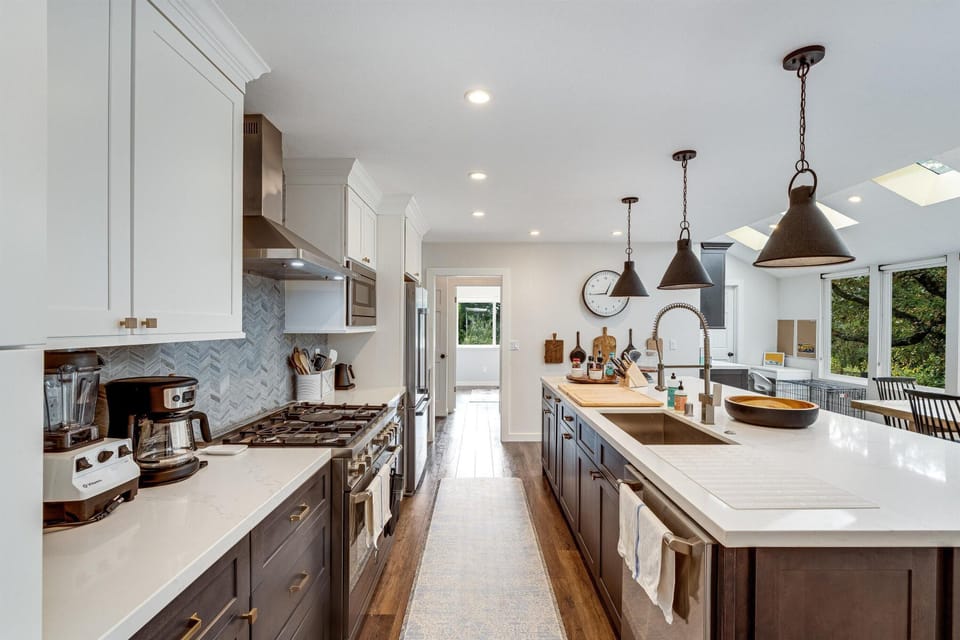 Spacious kitchen with modern appliances and bright island seating