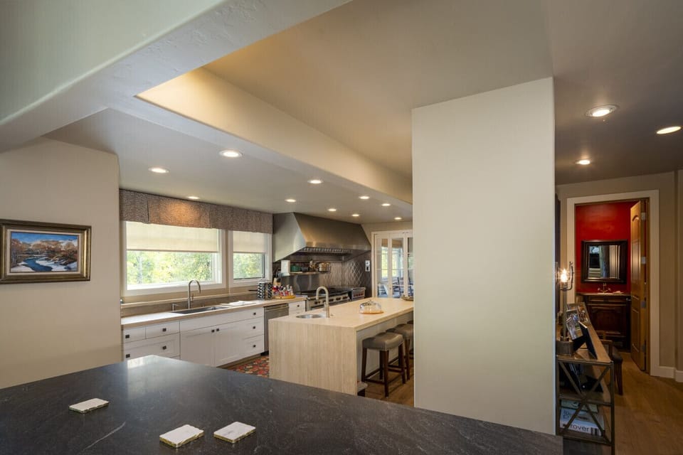 Kitchen island bar overlooking the spacious kitchen.