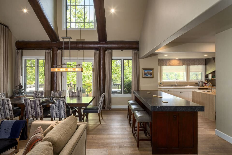 Open-concept layout connecting the great room with the kitchen and island area.