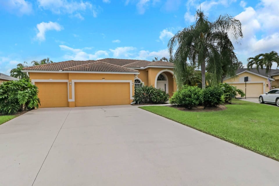 Tropical palms swaying in the breeze greet you upon your arrival; one garage space is available to guests, with additonal driveway parking if needed.