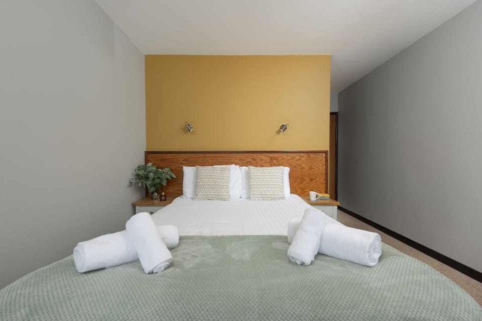 King Bed with bedside tables and reading lamps