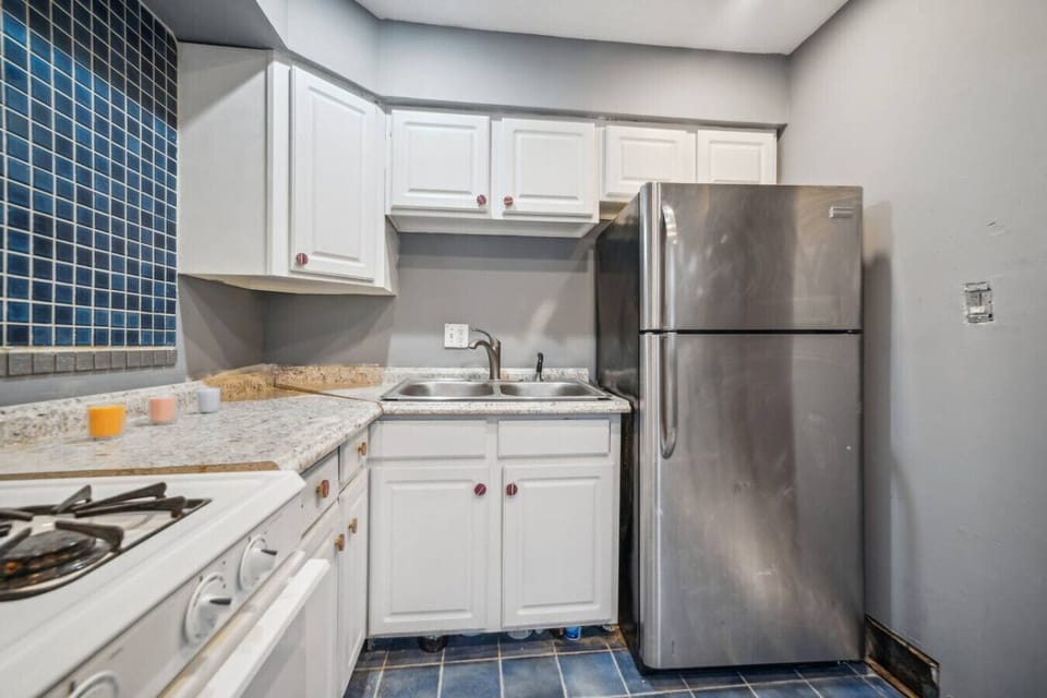 Prepare delicious home-cooked meals in this fully equipped kitchen, featuring full-sized appliances and all the essentials you need for your stay.