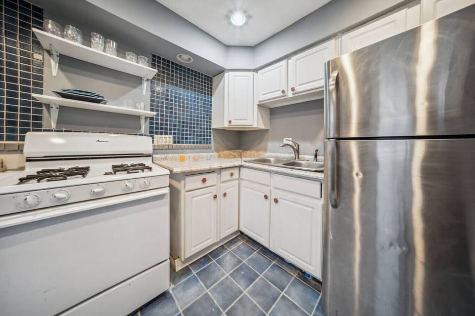 Prepare delicious home-cooked meals in this fully equipped kitchen, featuring full-sized appliances and all the essentials you need for your stay.