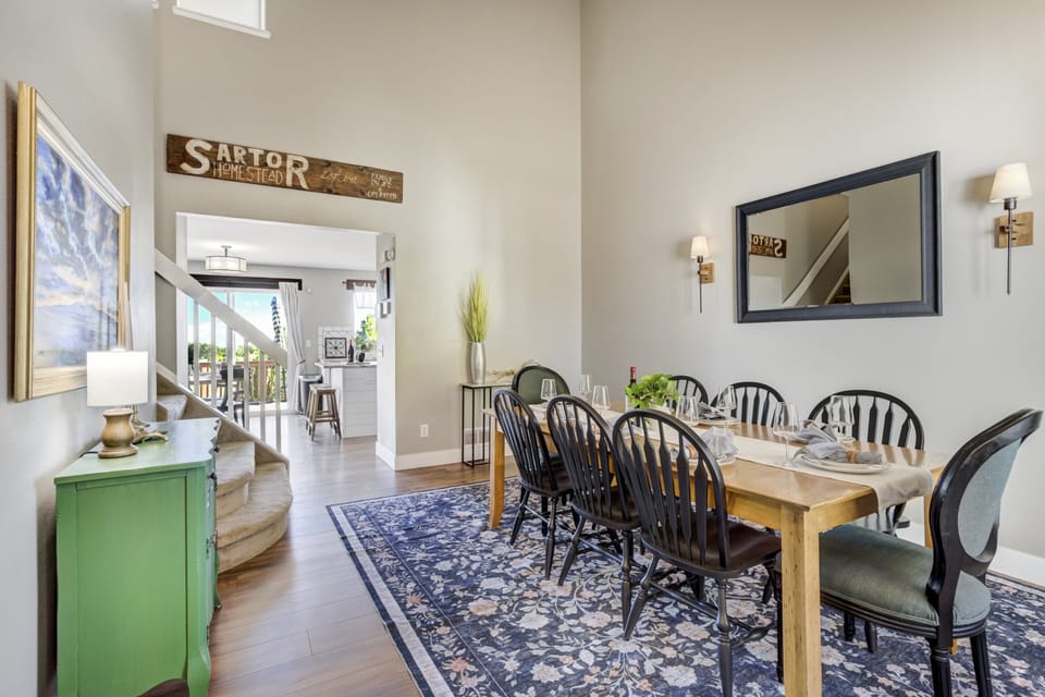 The formal dining room nearby comfortably seats eight for family dinners