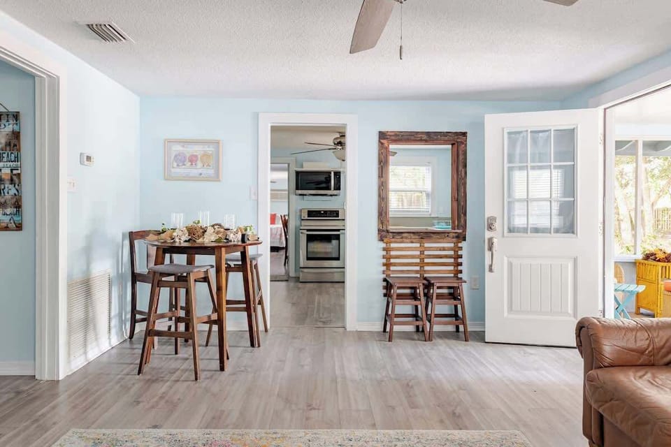 Gather for meals or game nights around this casual dining nook, featuring a high-top table with seating for four and an open layout that flows into the kitchen and living room.