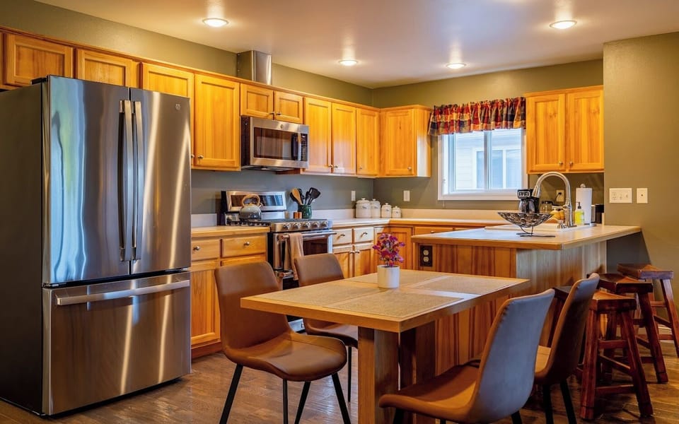 Bright, well stocked kitchen makes preparing meals a pleasure.