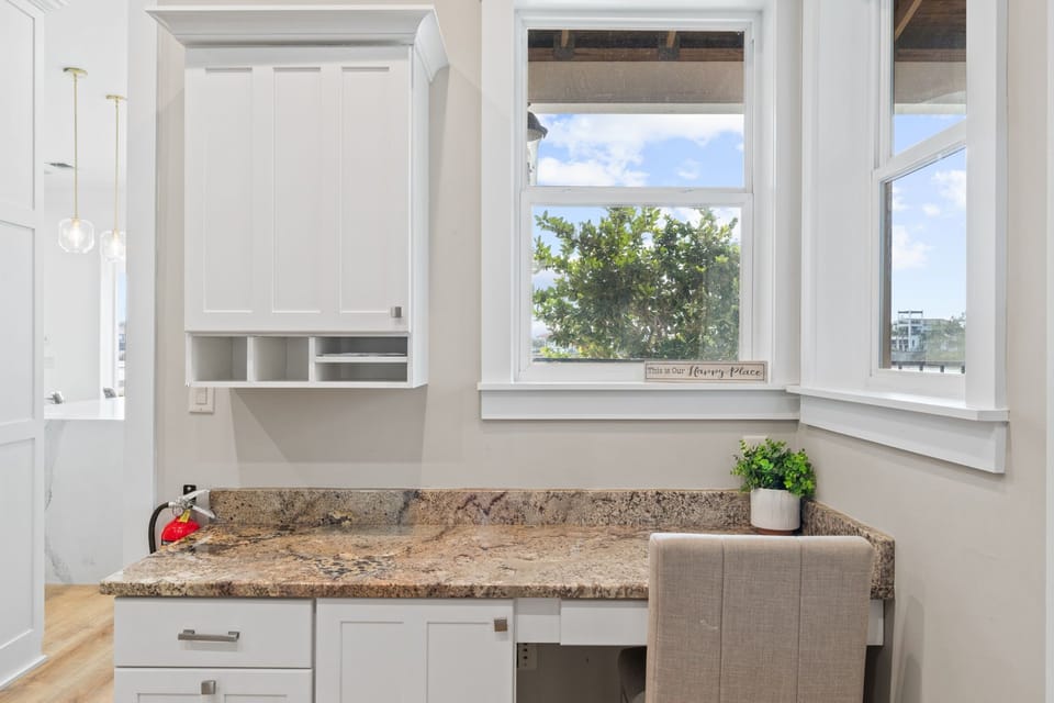 First Floor Laundry Room with Workspace and Secondary Fridge