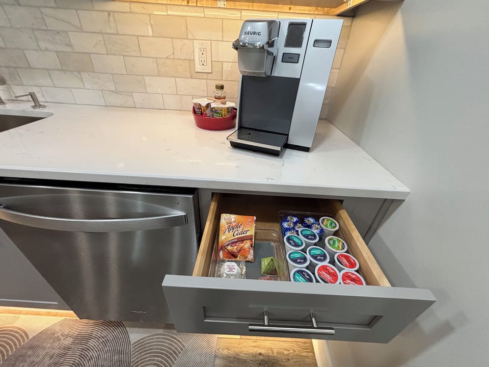 Regular and decaf coffee pods, some creamer and tea + honey