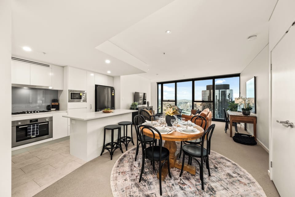 Dining room seating for 6 guests. 2 barstools at kitchen island