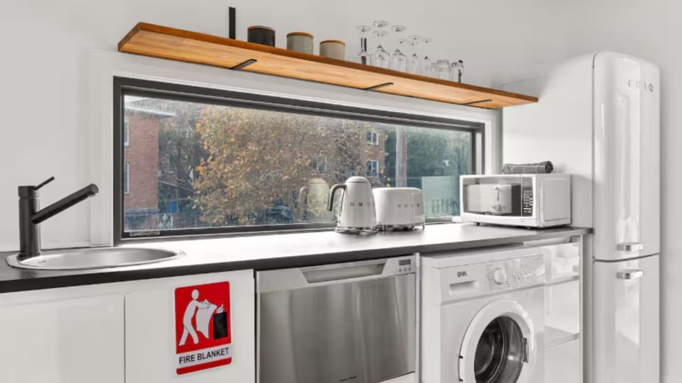 Kitchen sink area with large window view