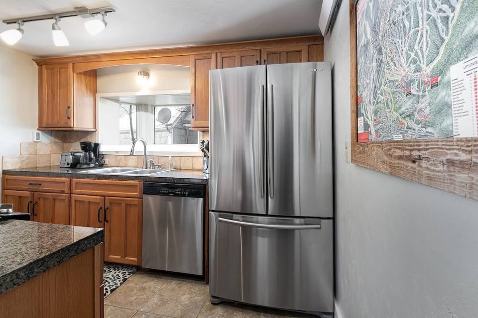 Kitchen: Main floor, drip coffee maker, toaster, Crockpot, cooking utensils, tableware
