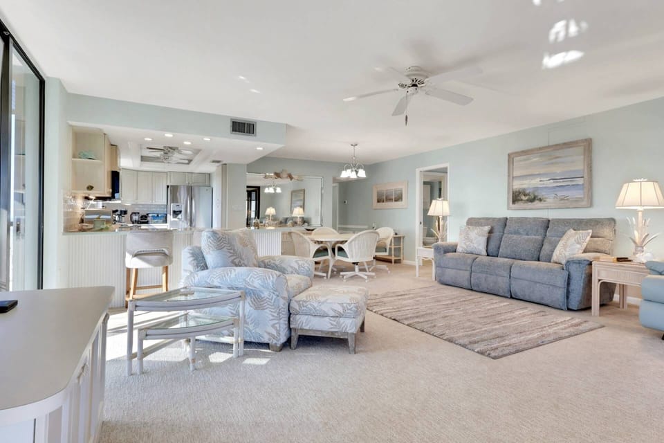 The open-concept main living space is furnished in an easy, family friendly style - that just invites comfort and relaxation.