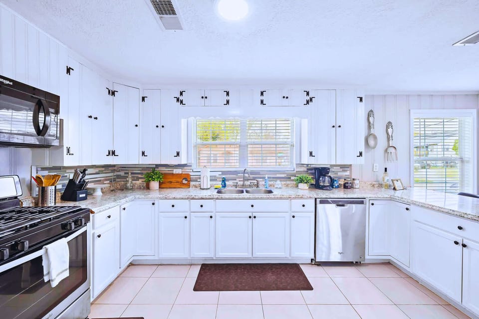 Kitchen: Whip up culinary delights in this stylish space with modern appliances and ample natural light!