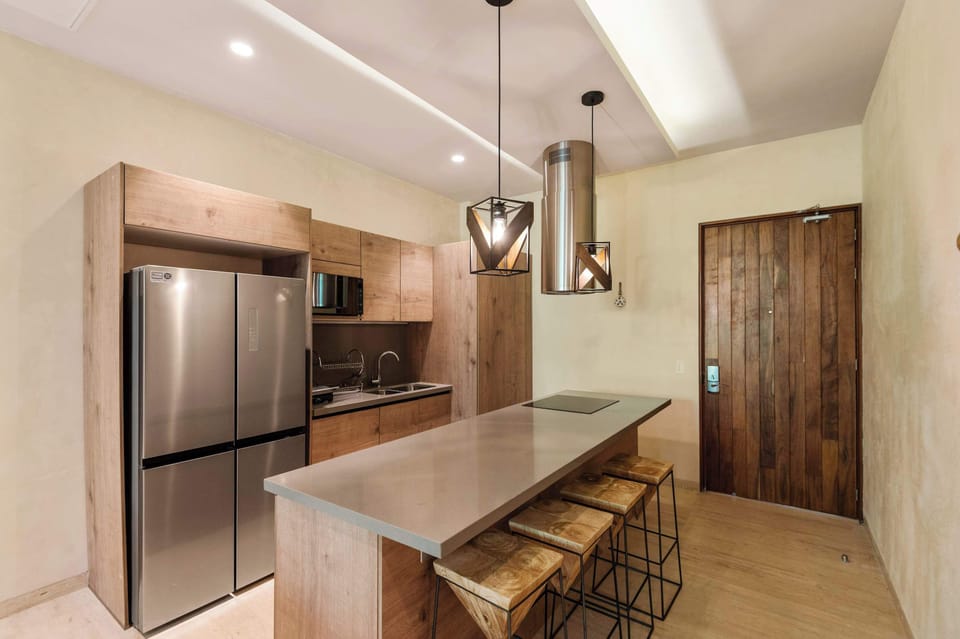  Modern kitchen with island, bar stools and wood finishes