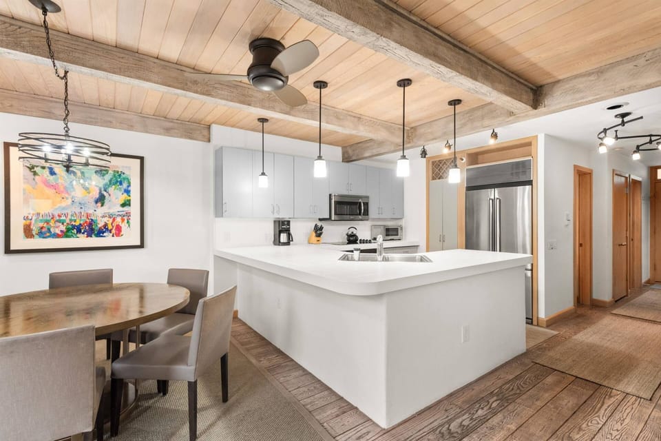 Modern kitchen with exposed beams—perfect for gathering after a day on the slopes.
