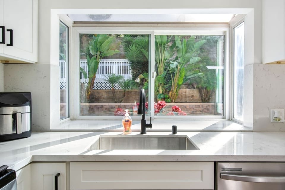 Cook and dine in a modern kitchen with bar seating for 2.