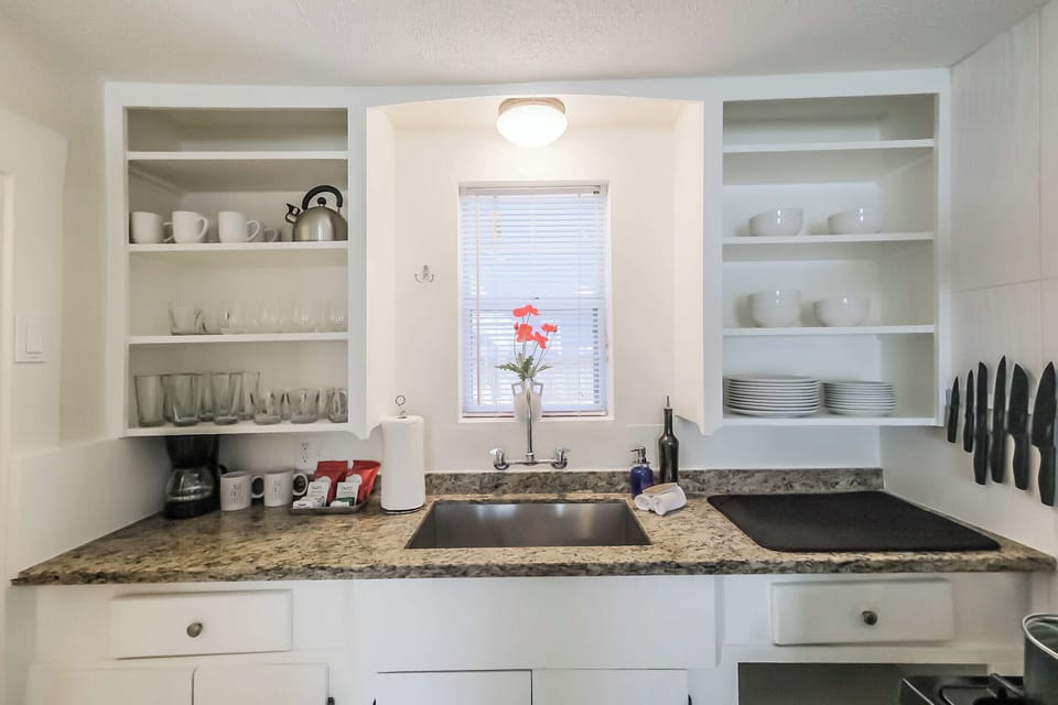Back House Fully equipped kitchen with modern appliances, cookware, and utensils, ready for any culinary need.
