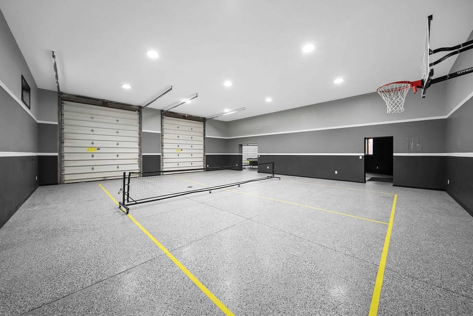 Indoor basketball and mini pickleball court in private entertainment complex