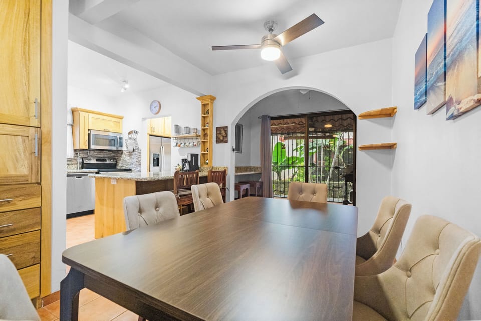 Enjoy meals at the 6 person table + 2 spots at the breakfast bar + 2 more seats at a workstation in the alcove beyond the dining space.
