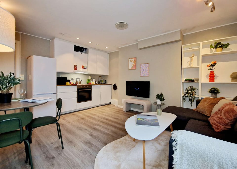 Full kitchen, living room, and dining area.