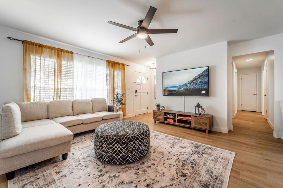 Cozy, family oriented living room with roomy sectional, comfortable and bright