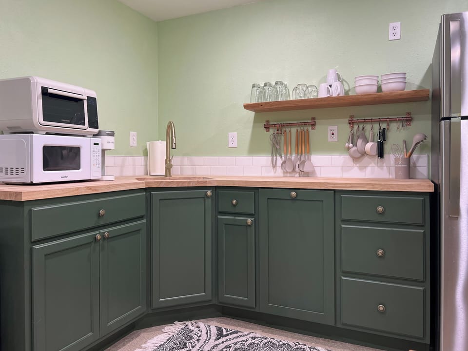 Kitchenette with hot plate, microwave, air fryer, coffee maker, and more
