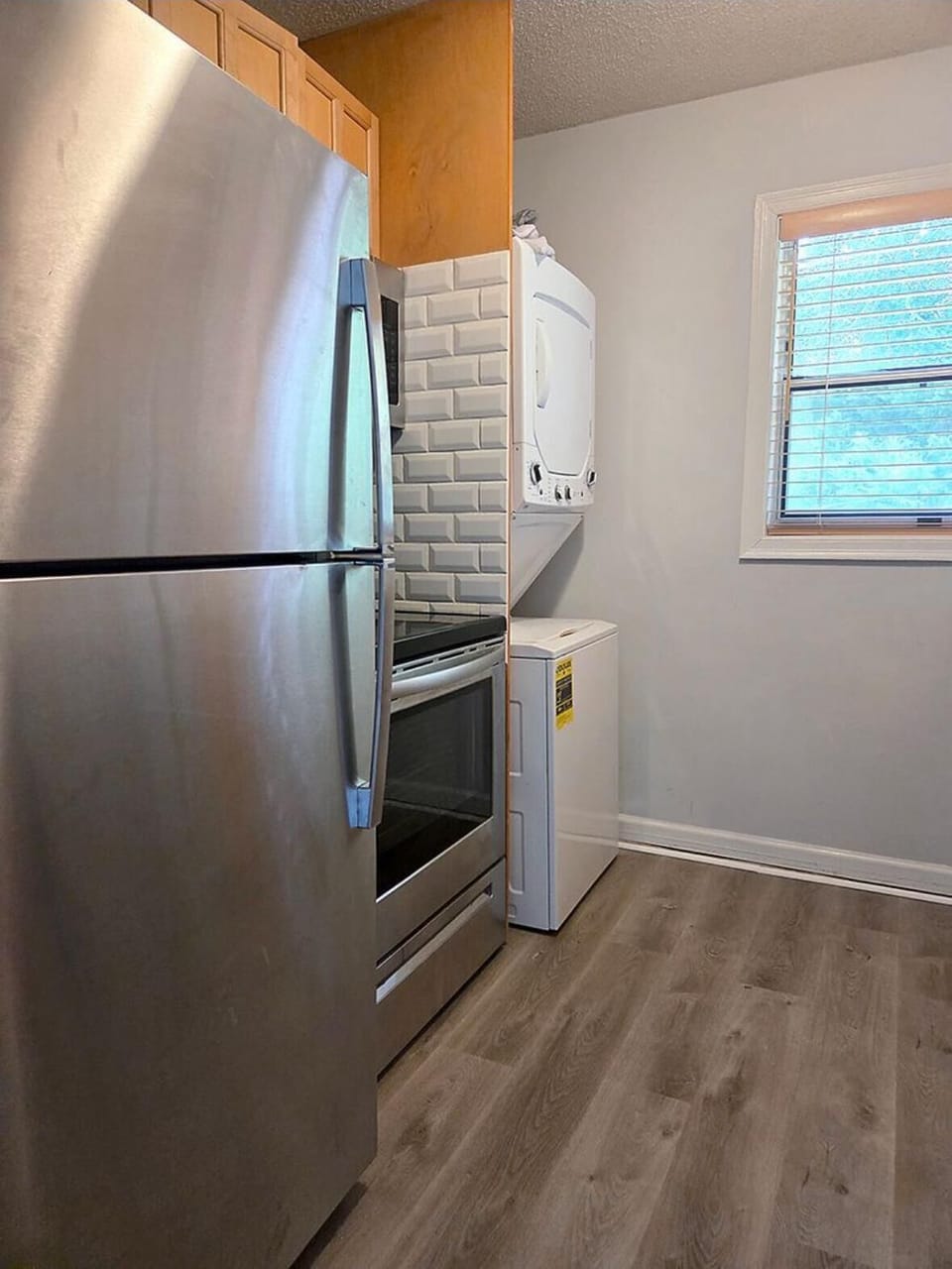 Full kitchen with washer and dryer area