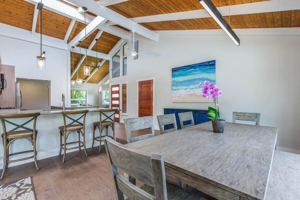 Gather for group dinners at Lani Oasis’ farmhouse-style dining table, adjacent to the airy living room and kitchen.