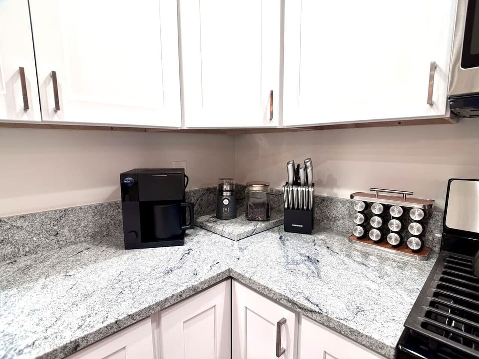 Coffee station with drip machine and grinder. We do supply coffee, tea, cream and sugar.