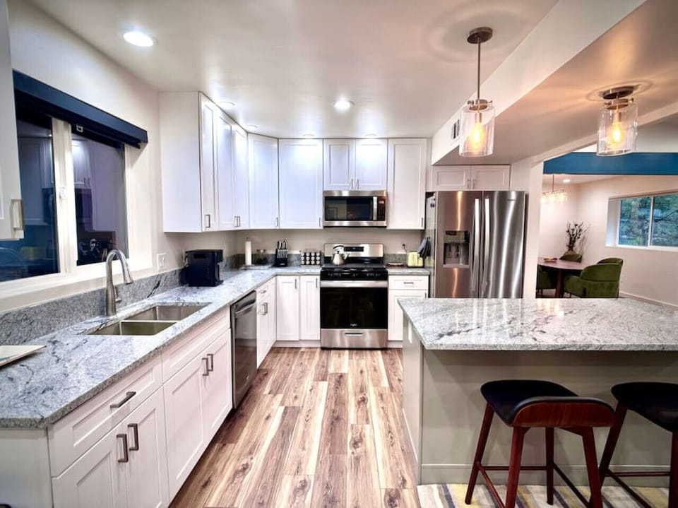 The newly remodeled kitchen is done to perfection with stainless appliances and granite counter tops.