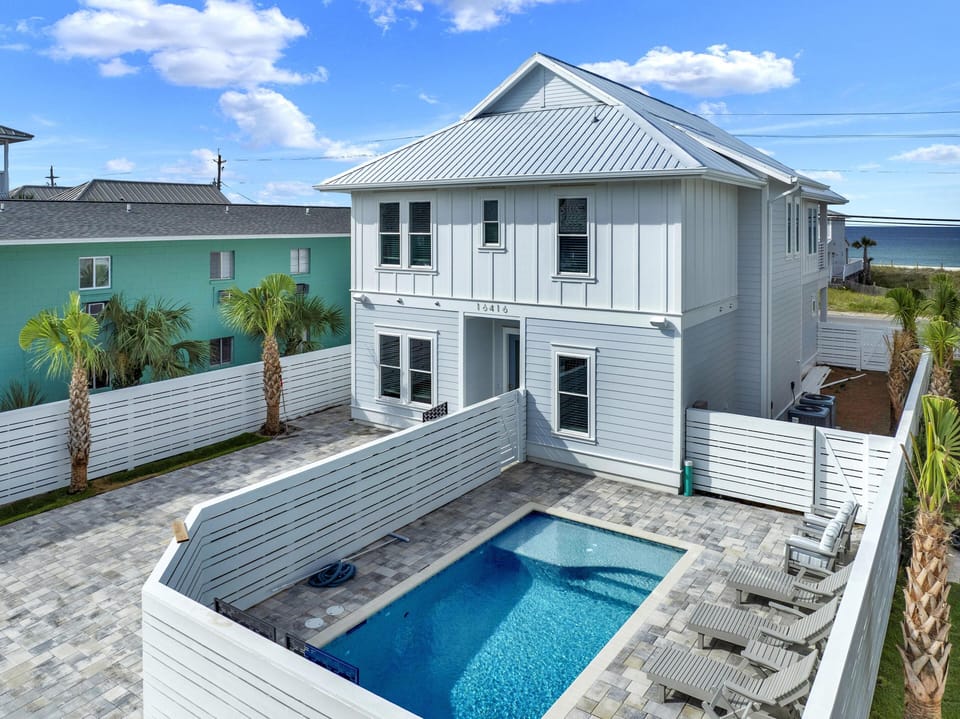 Private backyard pool with ocean views and spacious deck