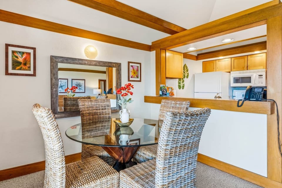 Charming dining space with island décor, wicker seating, and warm wood accents.