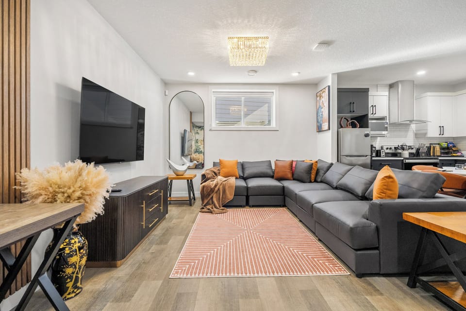Modern high end furnishings make this spacious living space stand out. Outfitted with a comfortable couch perfect for a relaxing movie night to help wind down after your adventures. Modern and stylishly decorated comfortable family-friendly space