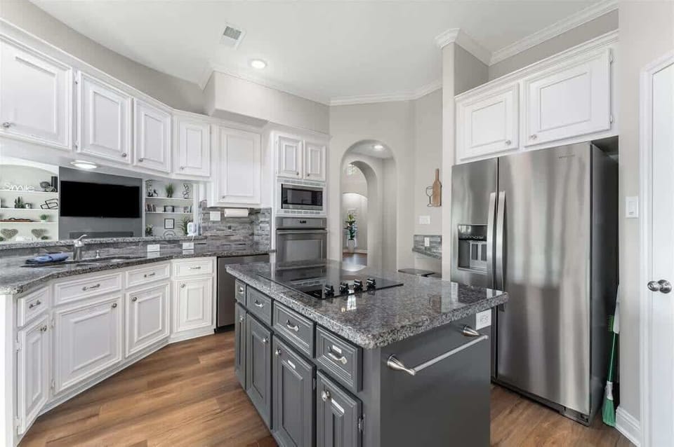 Planing to cook? High ceilings, lake views, and a well stocked kitchen makes this the perfect place to share meals with friends or family.