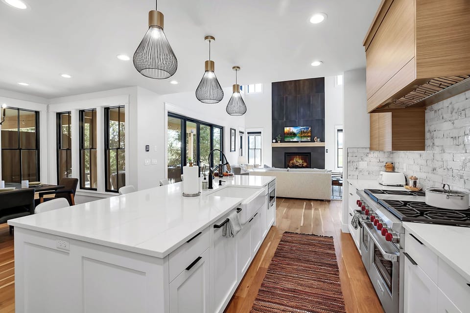 Chef’s Delight in the Open Kitchen: Cook up a storm in a kitchen that's part of the action. With a marble island and modern appliances, meal prep becomes a social event.