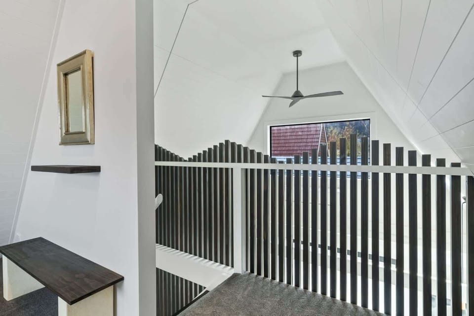 Loft-style landing with unique timber detail and ceiling fan
