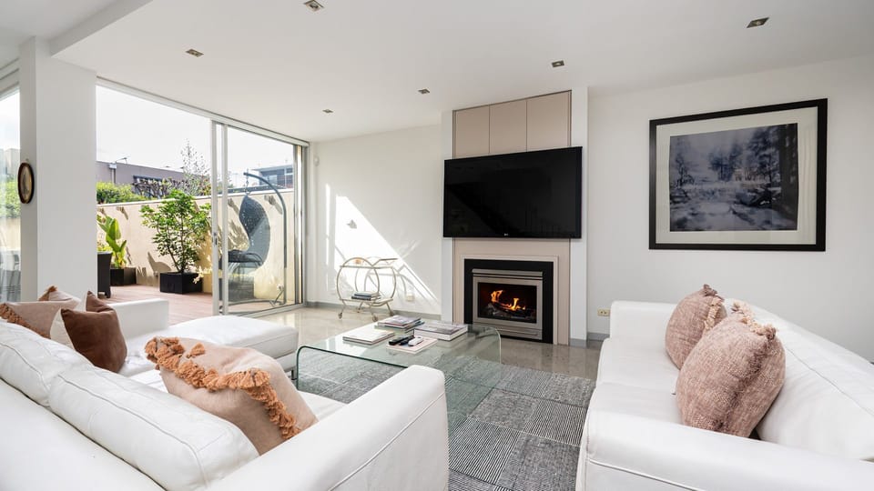 Light bright living room with fireplace  and smart TV