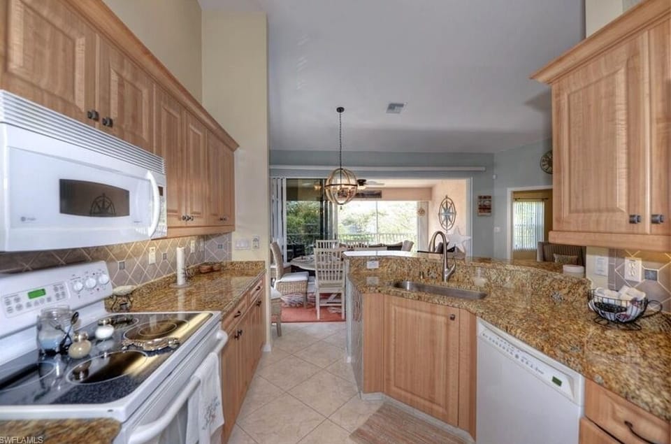 Functional kitchen with full appliances and ample storage for everyday living.