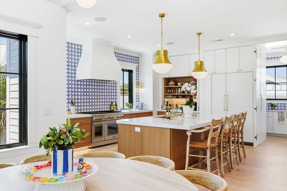 Gourmet kitchen with seating at island for 4 and tucked away scullery