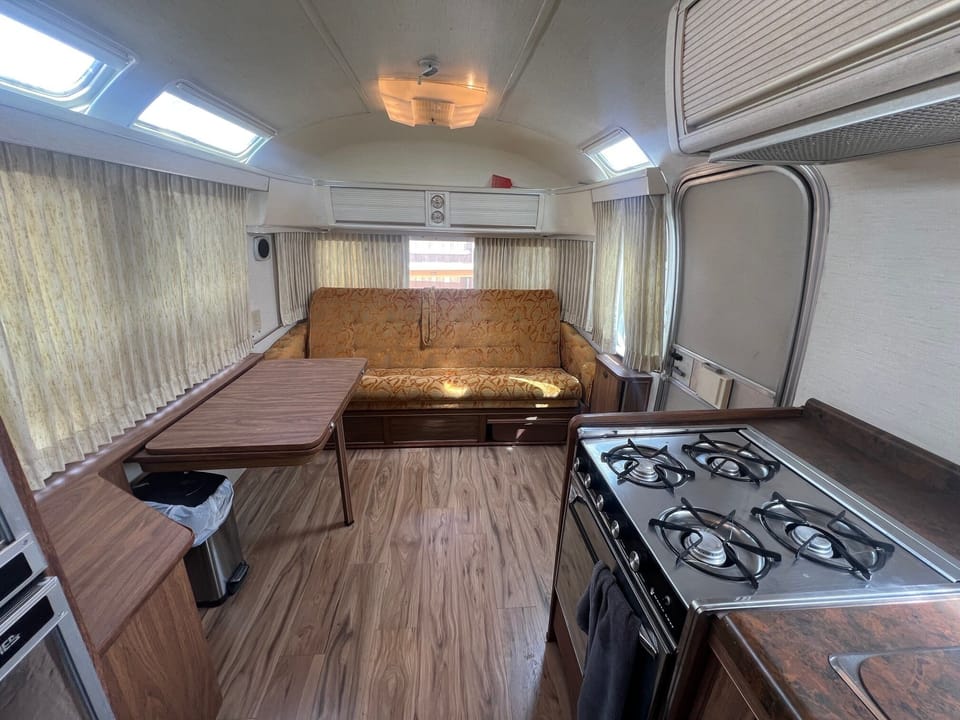 Table tucks against wall and This sofa will fold out into a bed